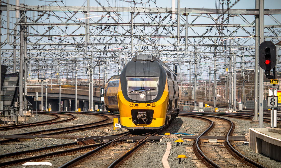 NS train travelling on Dutch railway tracks