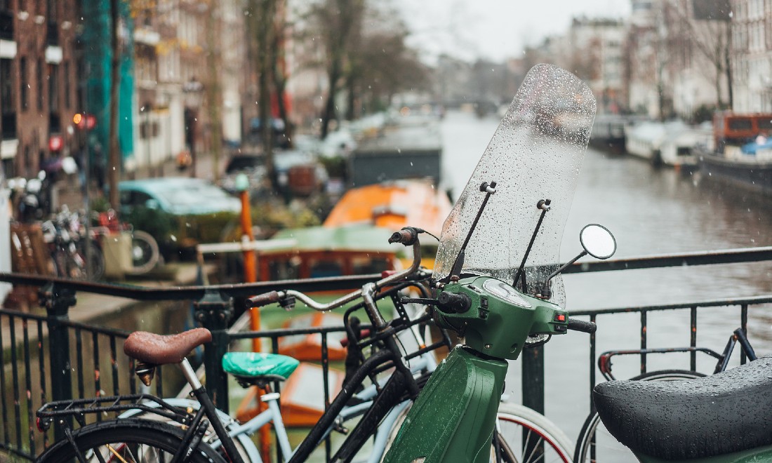 Rain Amsterdam canal bike vespa