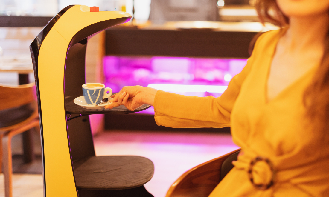 Robot waiter serving drinks in a cafe