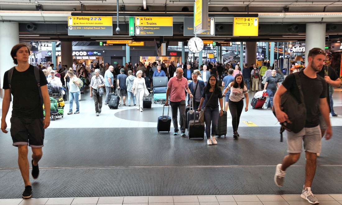 Schiphol Airport the Netherlands flights delays queues summer holidays