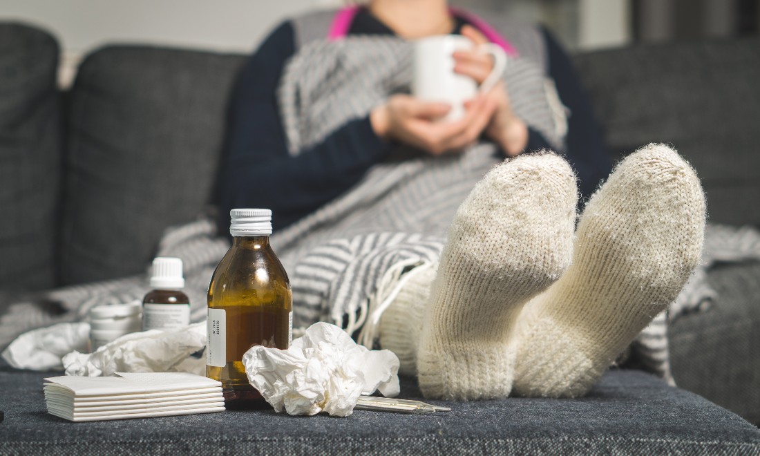 Woman at home, off sick from work