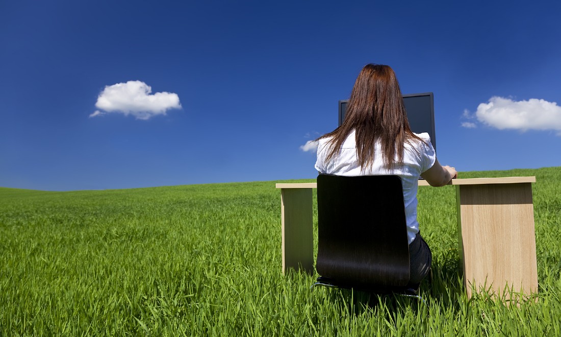 woman at desk in nature