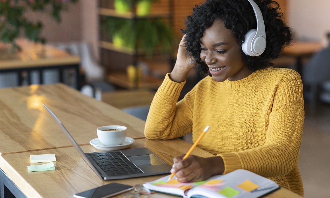 woman on laptop learning language