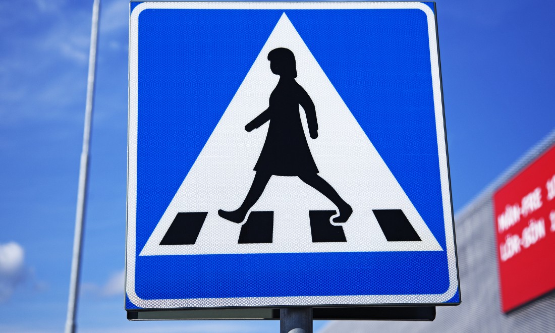 Traffic sign with a female figure