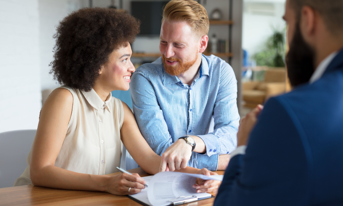 TSS Mortgages man and woman signing papers