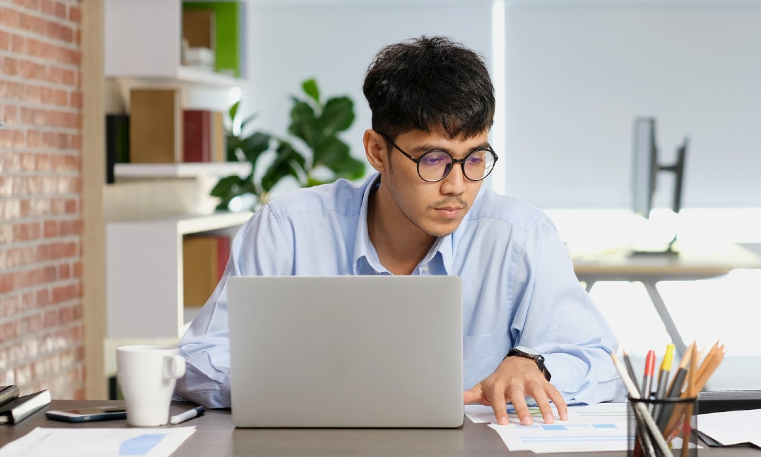 man working from home on laptop