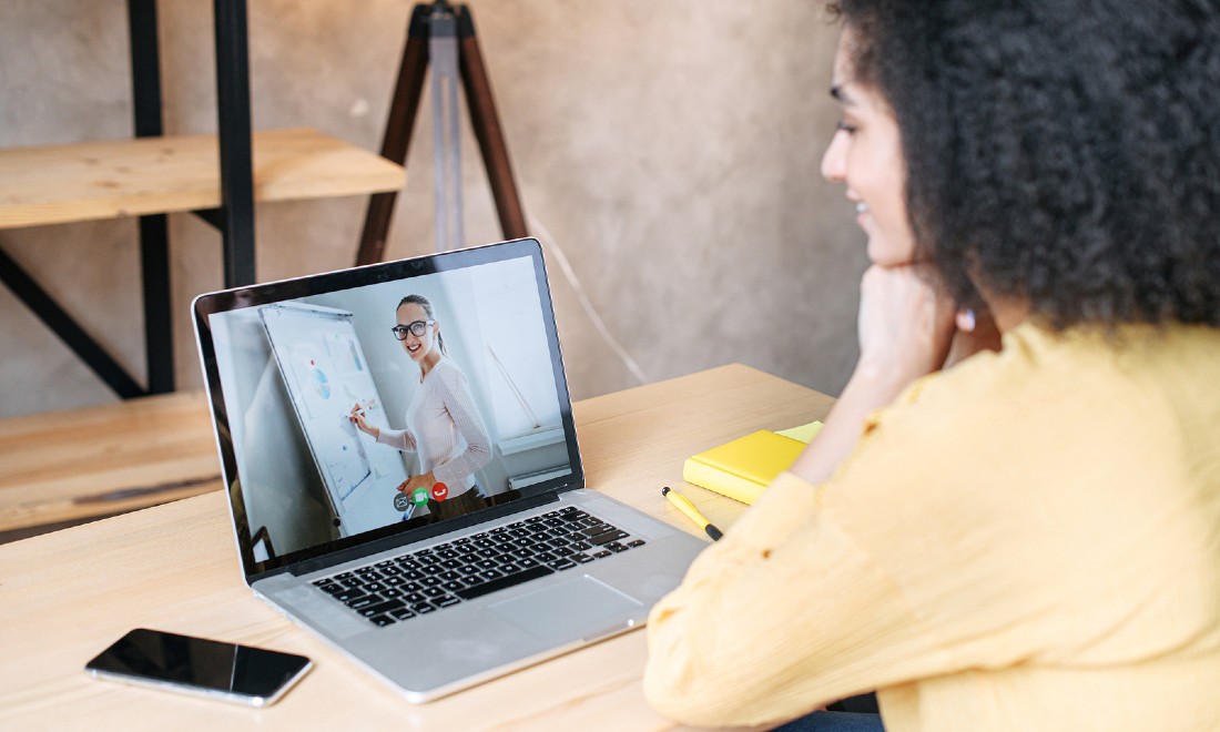 woman taking online course on laptop