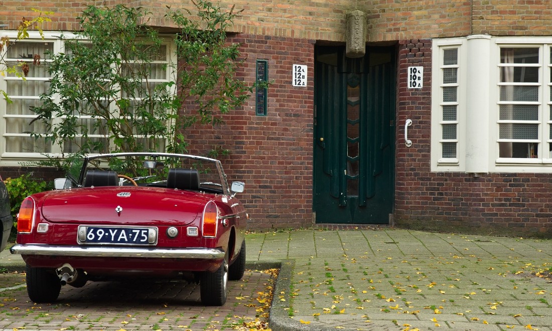 vintage car outside De Stijl apartments Amsterdam