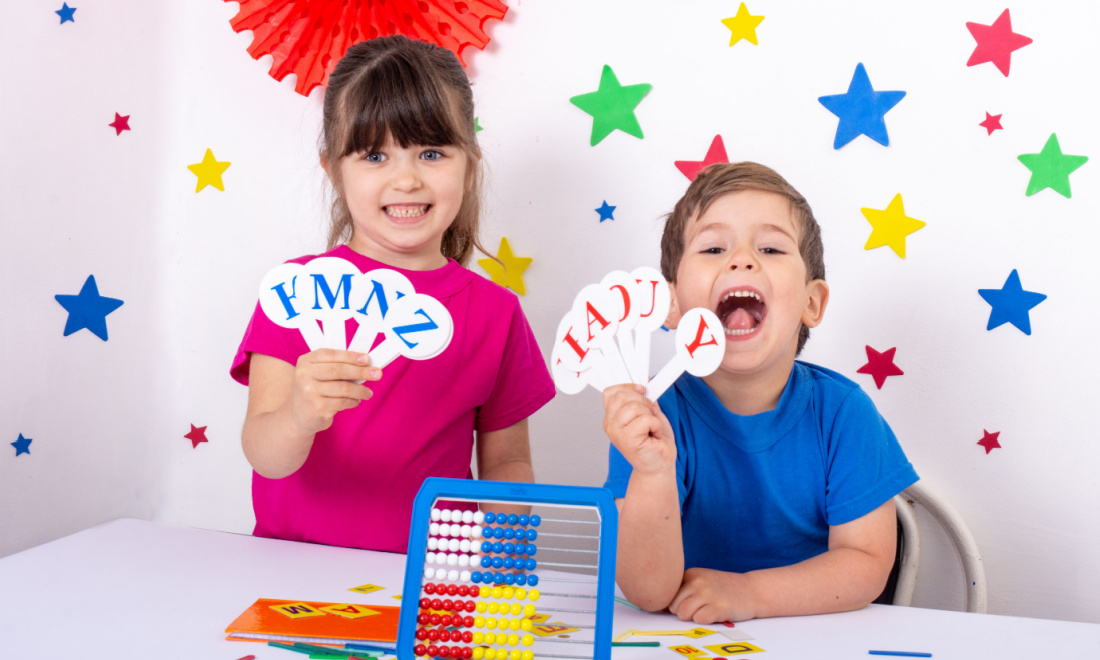 wendy van dalen children holding alphabet letters