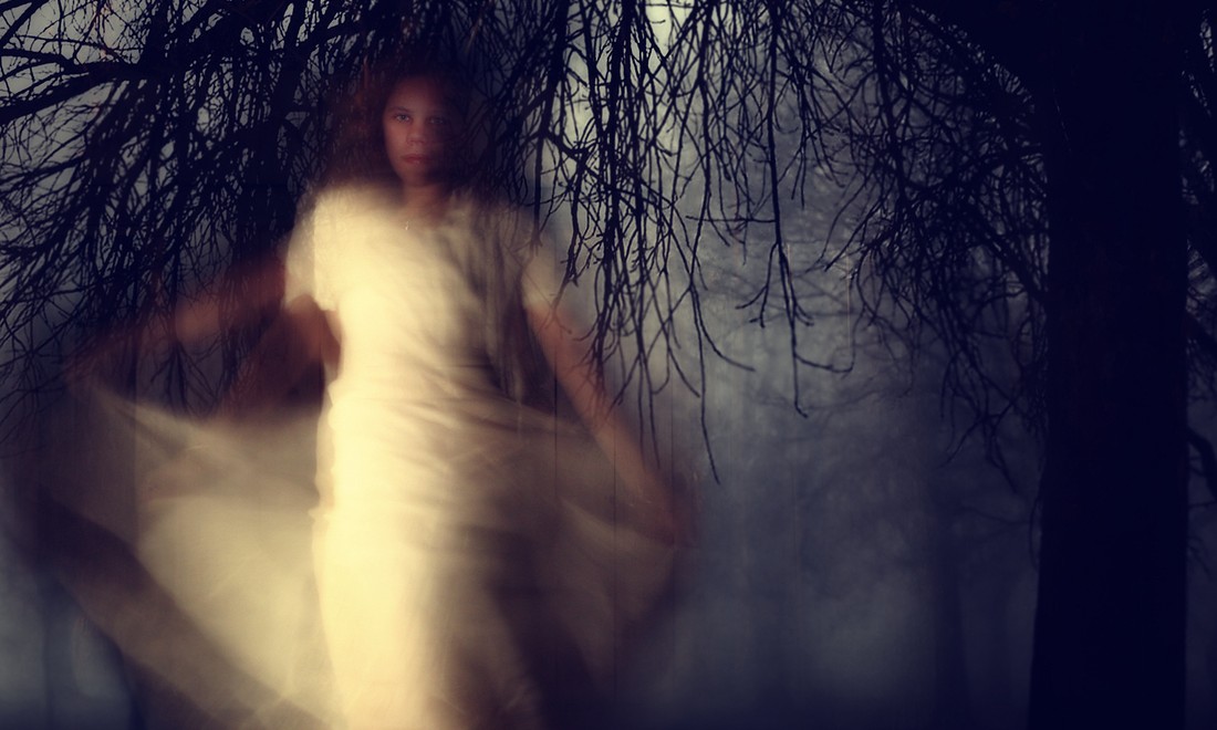 Ghostly woman in forest