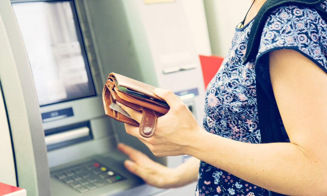 Woman cash machine ATM the Netherlands