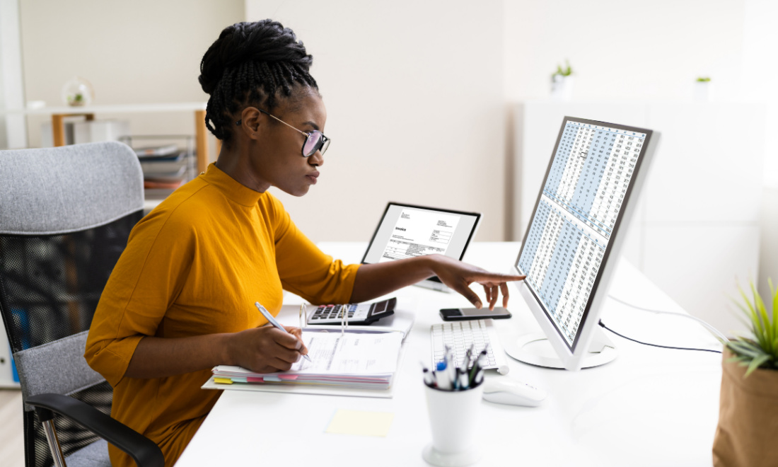 woman doing taxes on computer