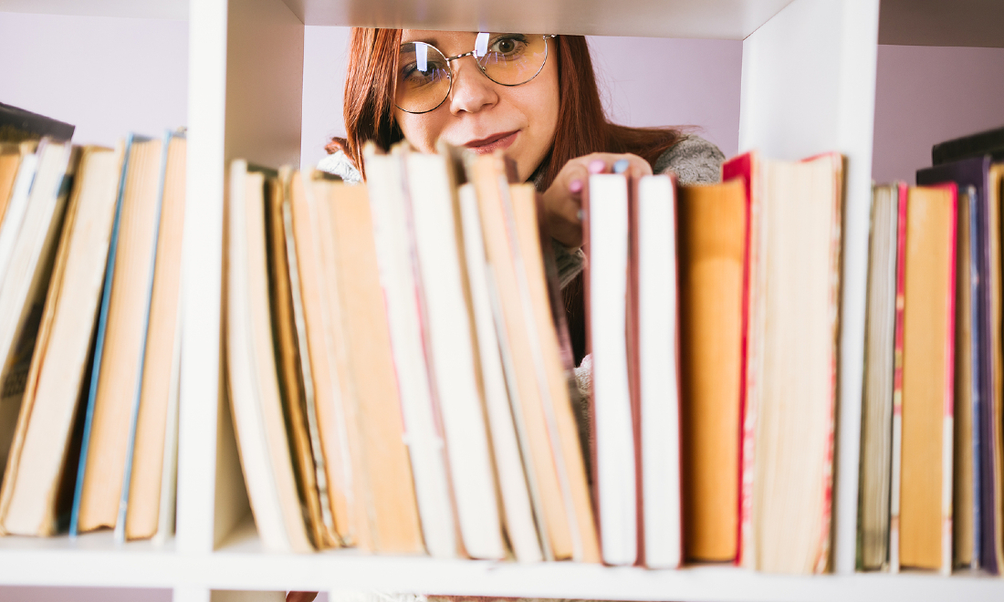 woman in a library finding a dutch book