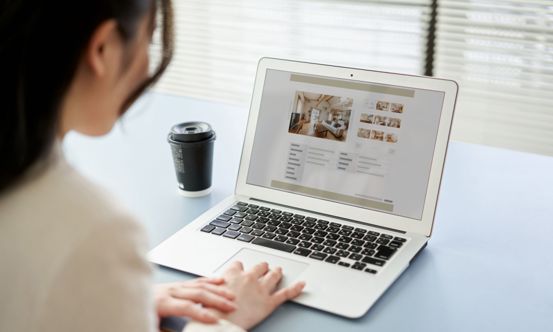 ags woman looking housing on laptop