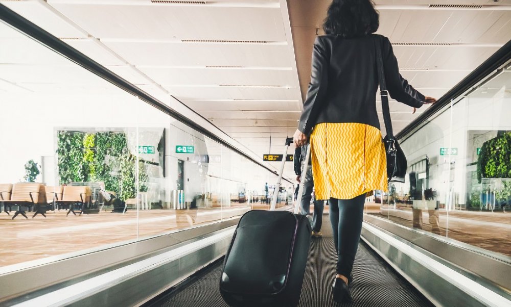 woman passenger suitcase airport