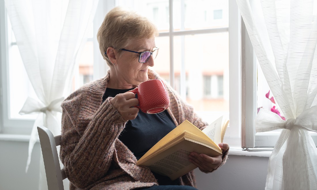 Senior woman reading book pension