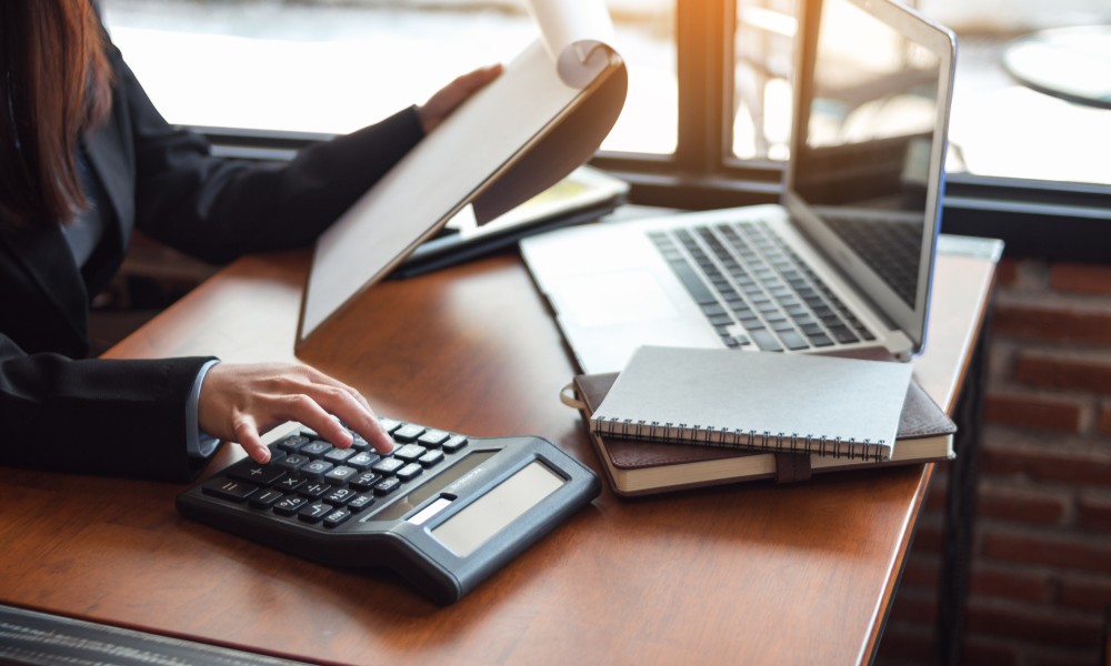 woman using calclulator