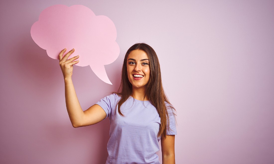 Woman holding a speech bubble