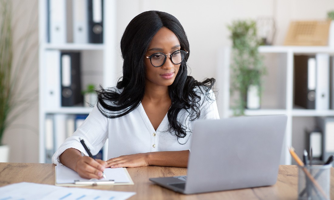 female entrepreneur working on laptop