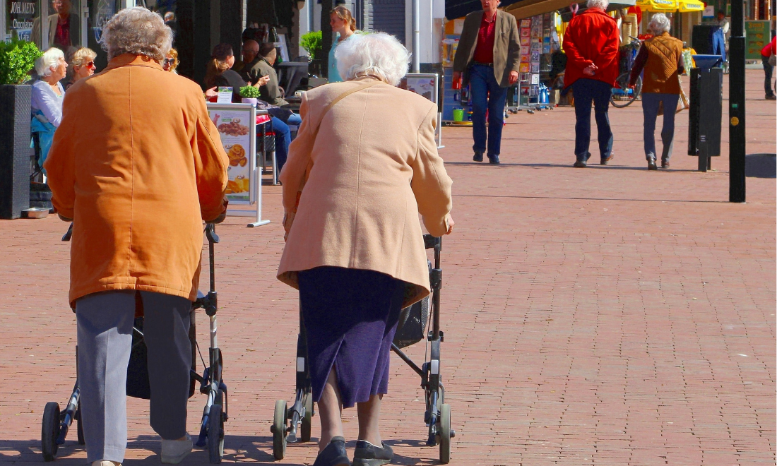 Retired women walking through Dutch city centre