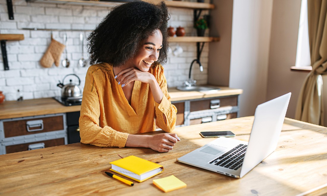 woman working from home kitchen table