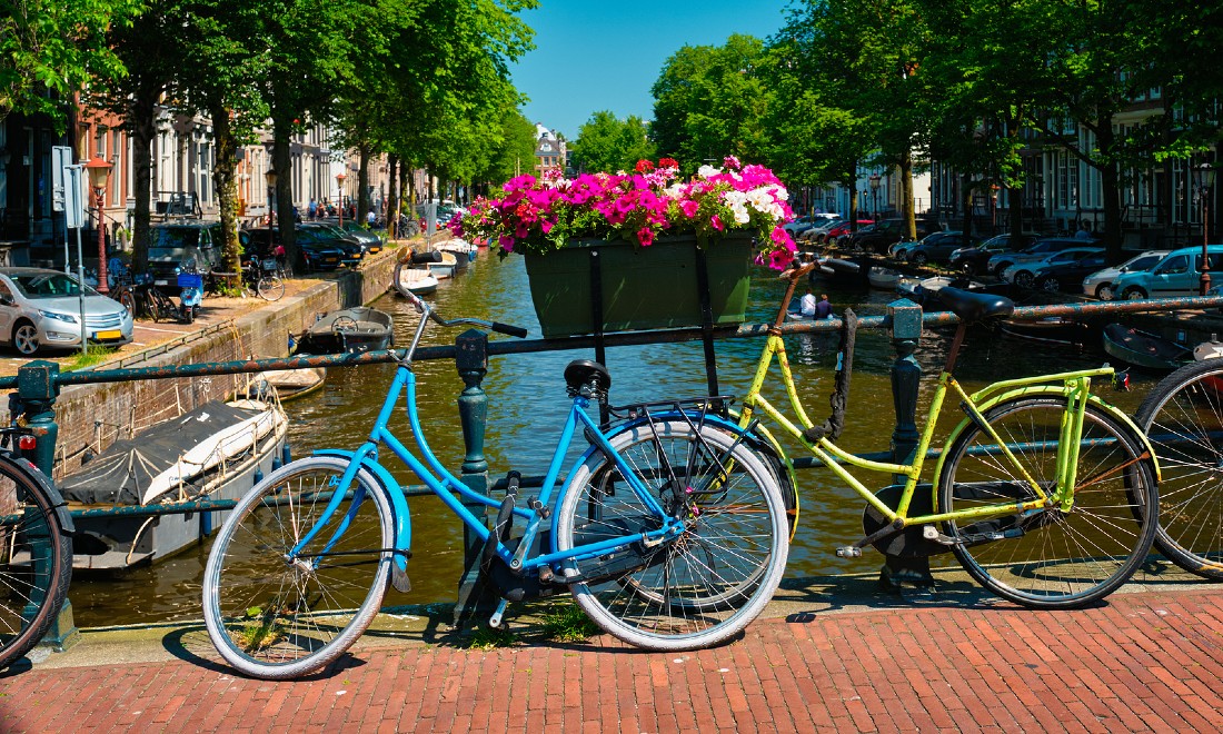 amsterdam canal, two parked bikes