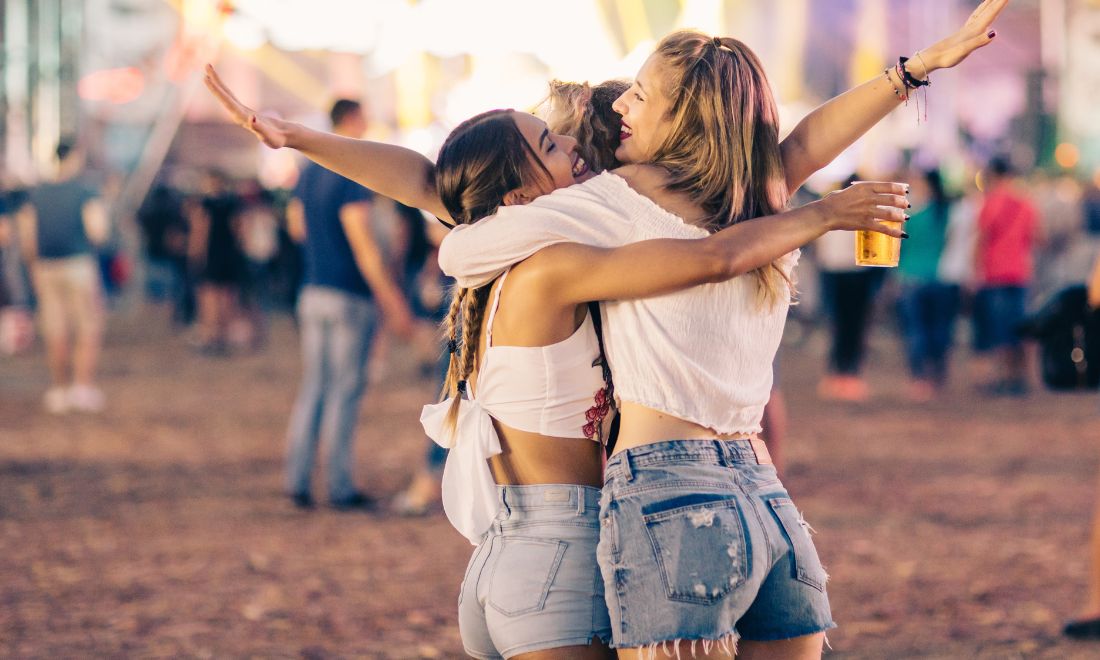 Young women enjoying a music festival