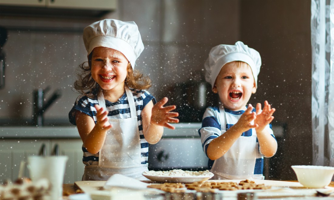 kids having fun making cookies in kitchen